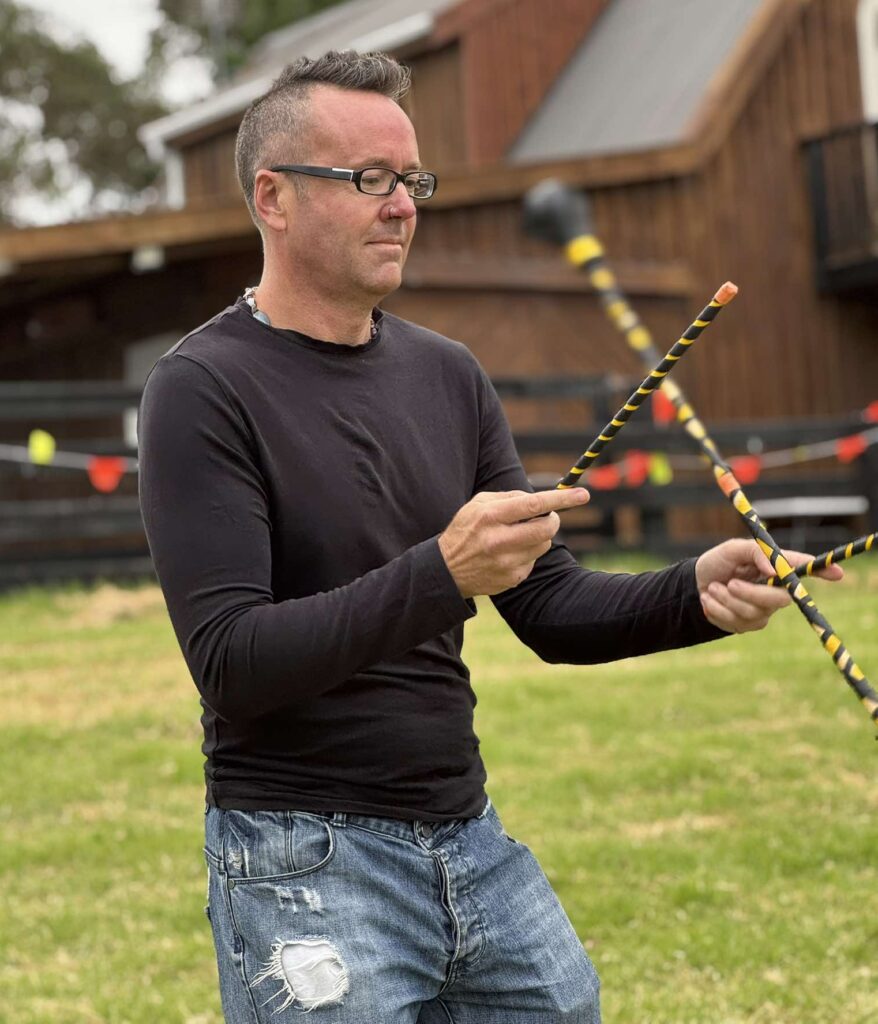 Shane Butler with flower/juggle sticks